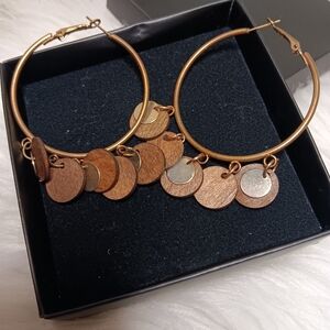 Looks like coins and wooden circle chips earrings.